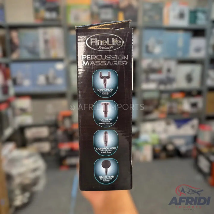 A boxed percussion massager with four interchangeable heads, including a spine head, flat head, cylindrical head, and round head.