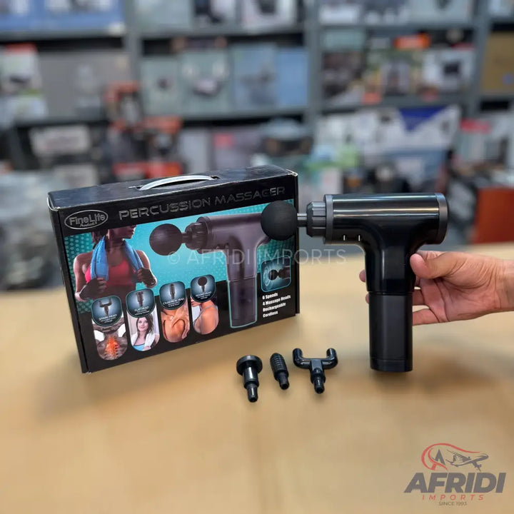 Black handheld percussion massage gun with multiple interchangeable heads.