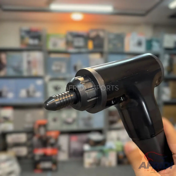 Black handheld electric screwdriver with a flexible shaft attachment.
