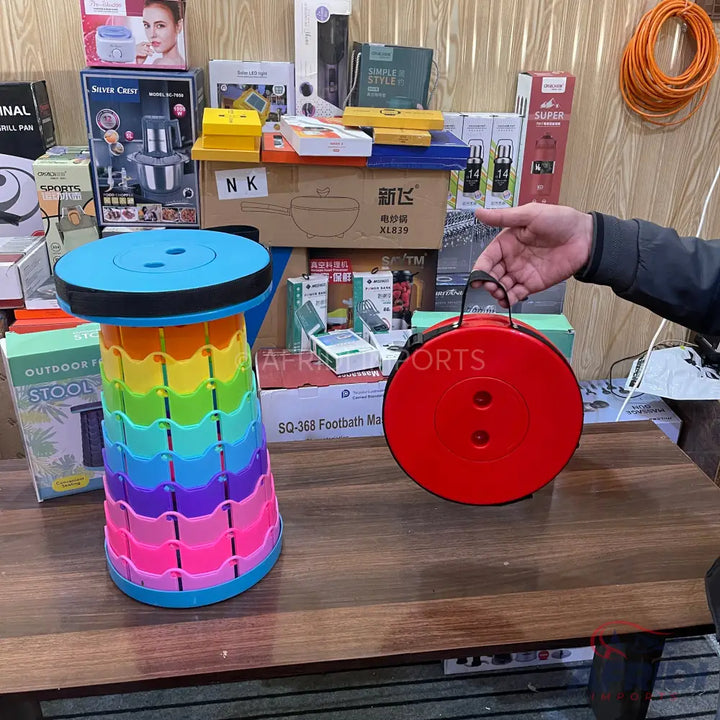 A multi-colored, collapsible, portable stool.