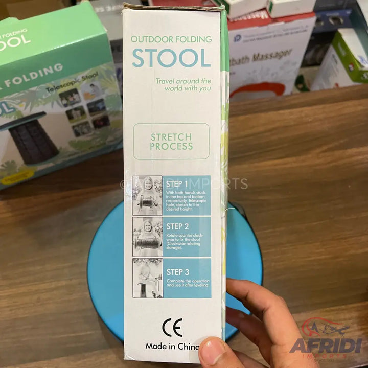 Packaged outdoor folding stool with instructions.