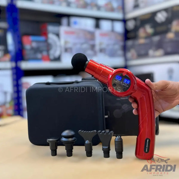 Red percussive massage gun with multiple interchangeable heads and a carrying case.