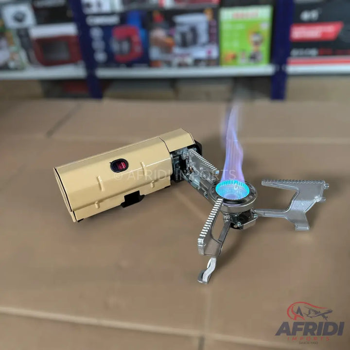 Portable camping stove with an active flame.