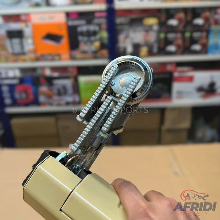 A handheld sewing machine.