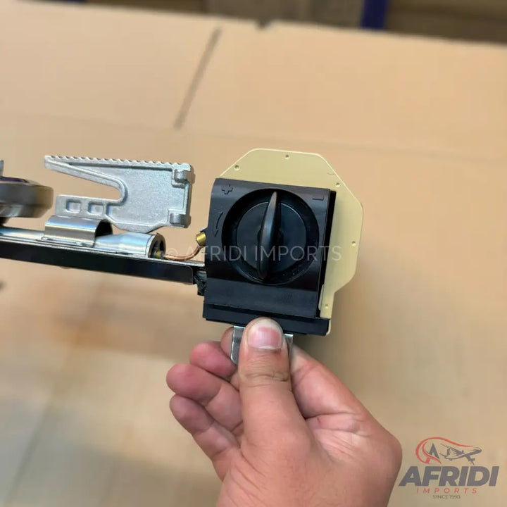 A portable gas stove burner with an adjustable control knob.