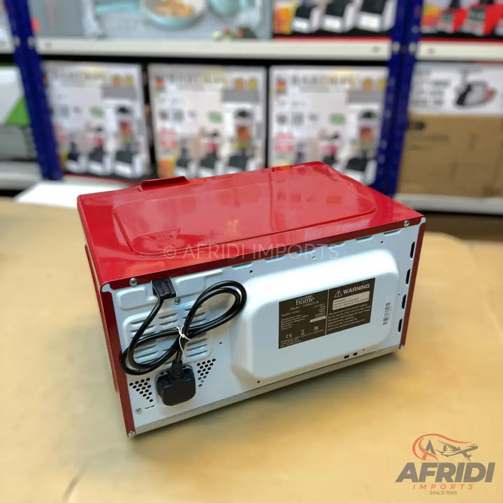 Red microwave oven with a black power cord and a 3-pin plug.
