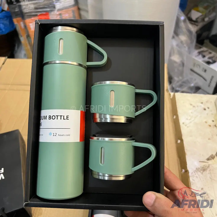 A light green vacuum flask with two matching handled mugs in a presentation box.