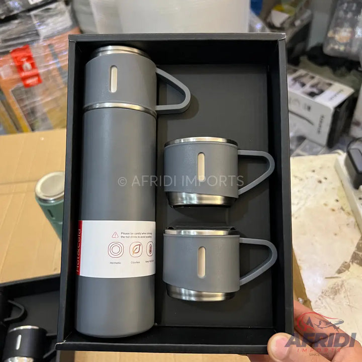 Grey insulated thermos with two matching mugs in a gift box.