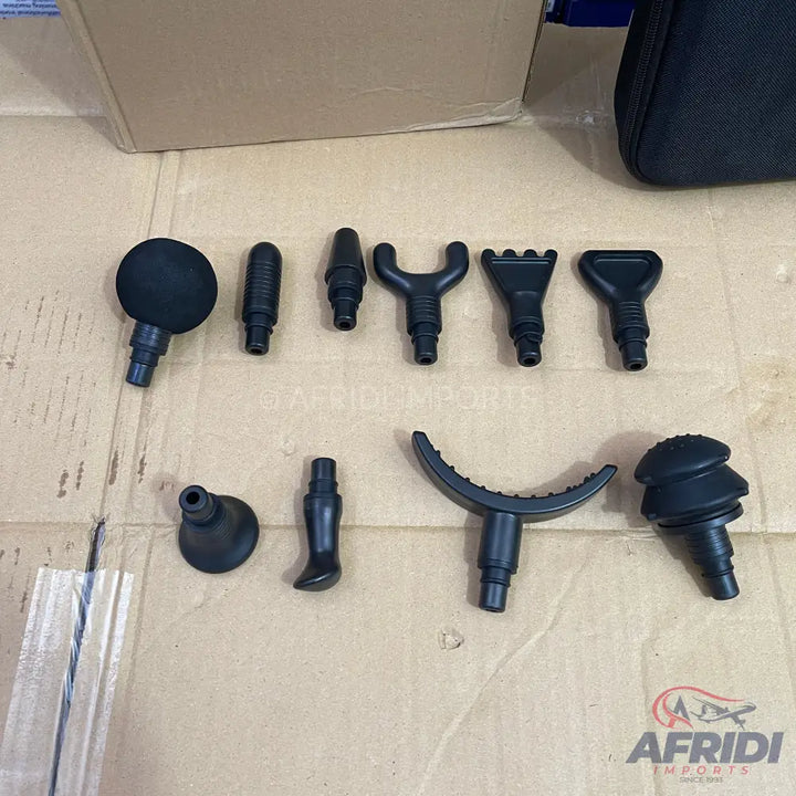 A collection of various black massage gun attachments.