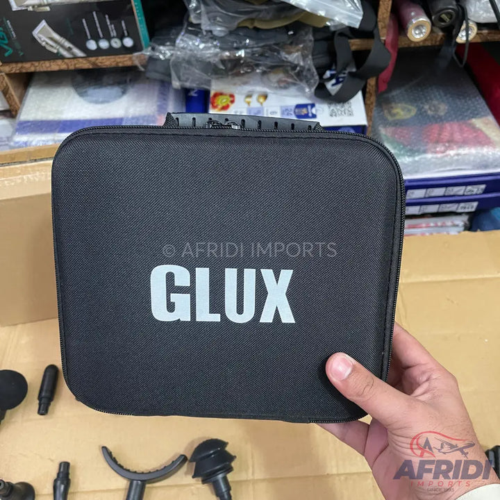 Black zippered carrying case for a massage gun.
