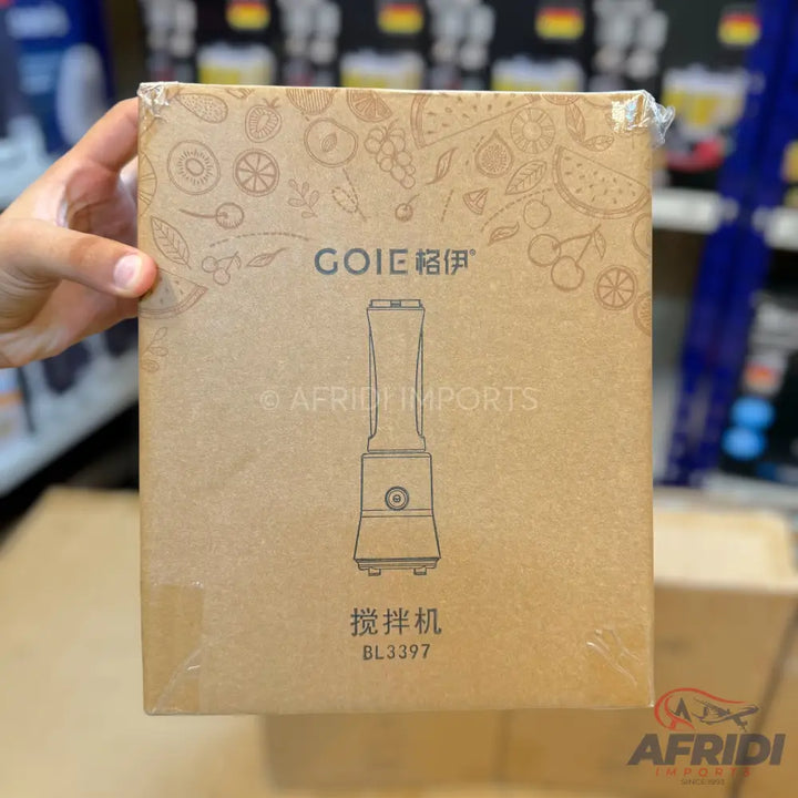 A portable blender in a brown cardboard box.