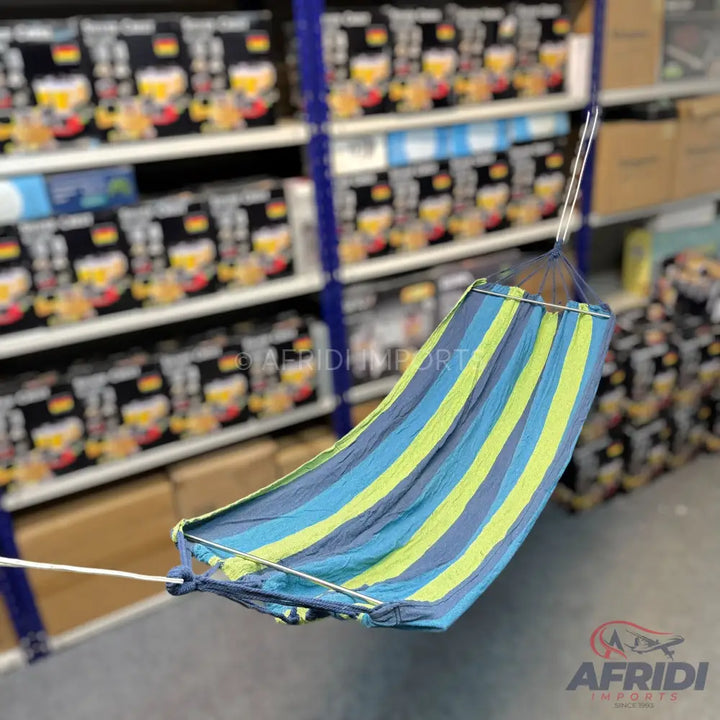 Blue and lime green striped fabric hammock with spreader bars.