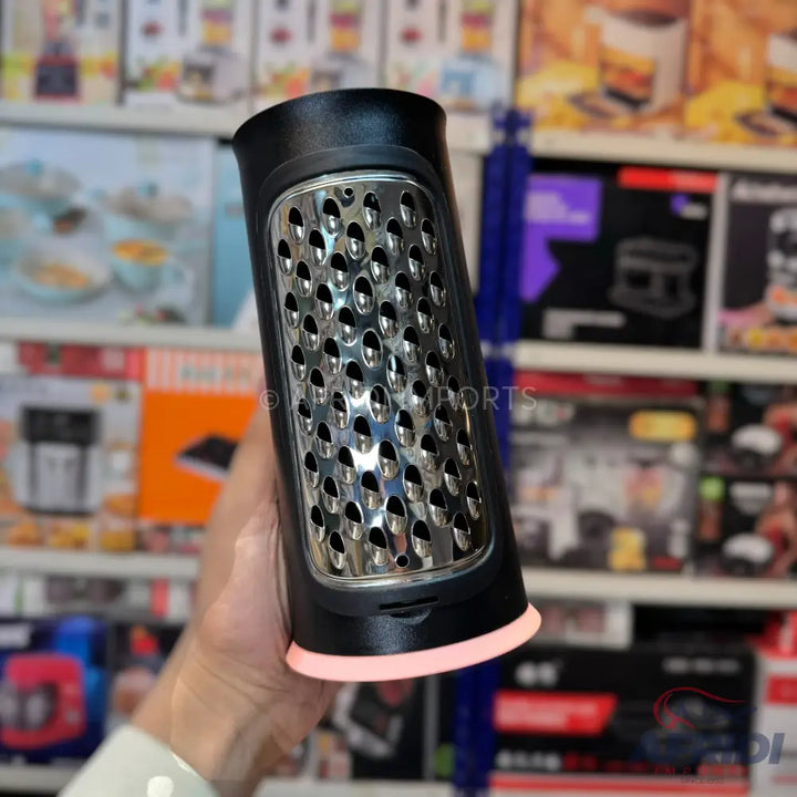 Black cylindrical grater with a light pink base.