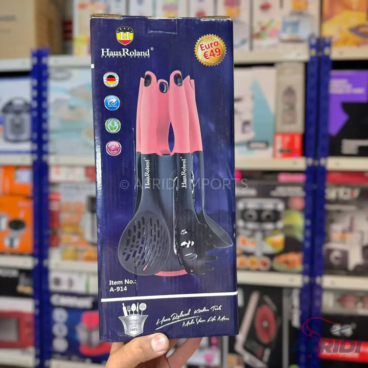 A boxed set of kitchen utensils with pink handles, priced at €49.