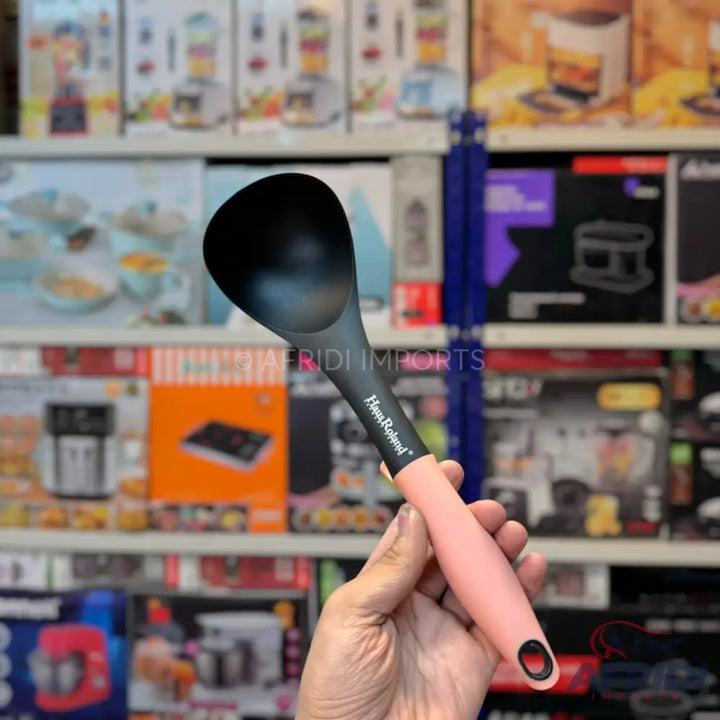 Black nylon ladle with a pink handle and hanging hole.