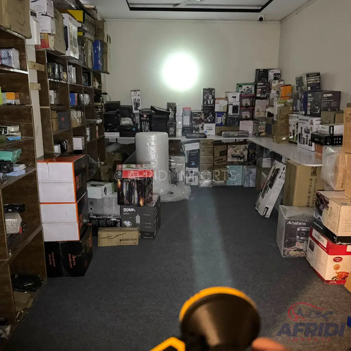 A yellow and black headlamp with a bright beam.