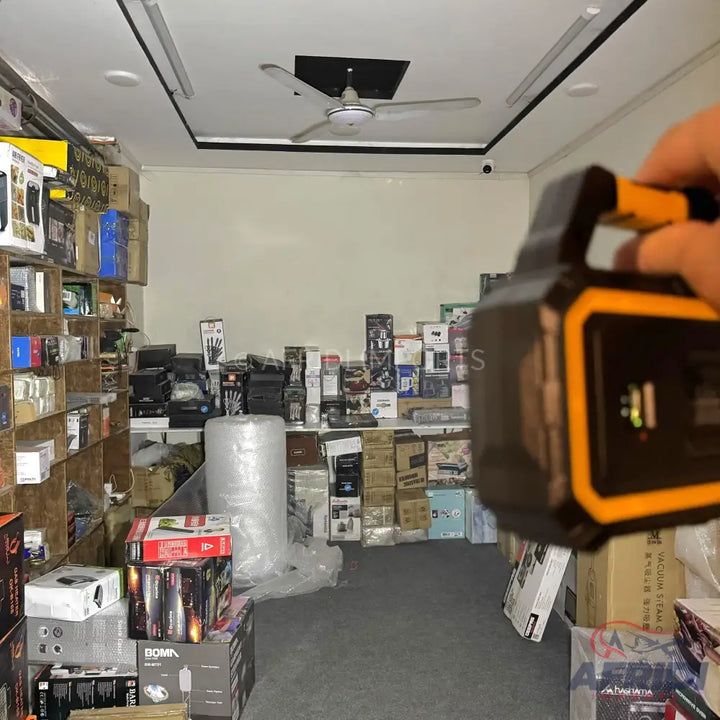 A portable power station with a black and orange casing and a carrying handle.