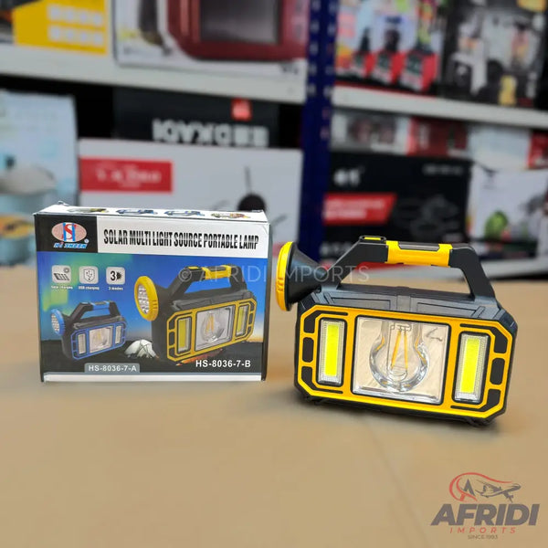 Yellow and black solar-powered multi-light portable lamp with a handle and a flashlight on one end.