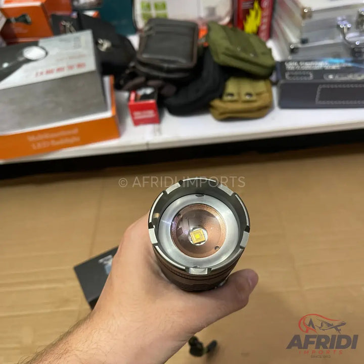 Handheld flashlight with a visible LED emitter.