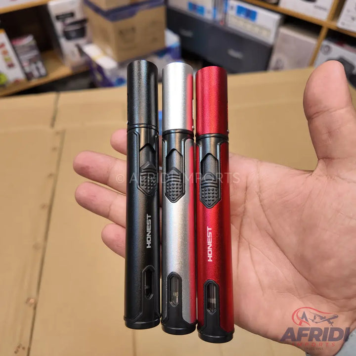 A set of three cylindrical lighters in black, silver, and red, each featuring a textured ignition button and a transparent fuel level window.