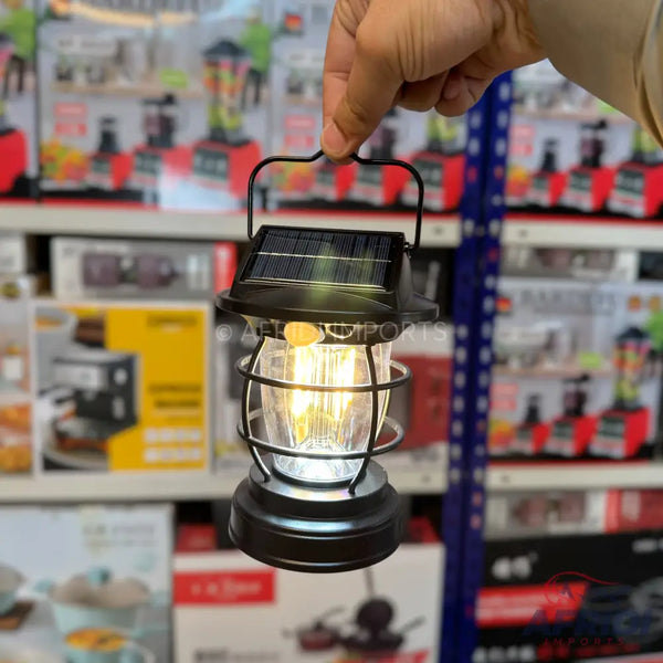 Hand-held solar-powered outdoor lantern with a classic, caged design.