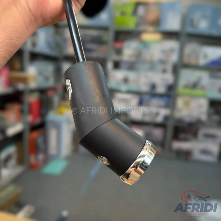 Black and chrome adjustable car cigarette lighter adapter.