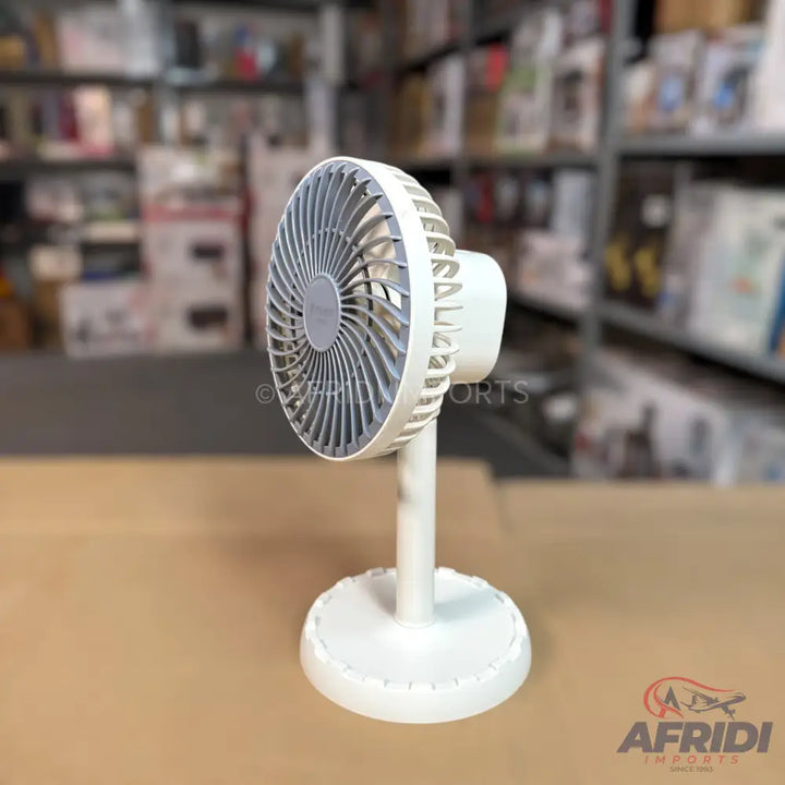 White portable oscillating fan with a gray grill.