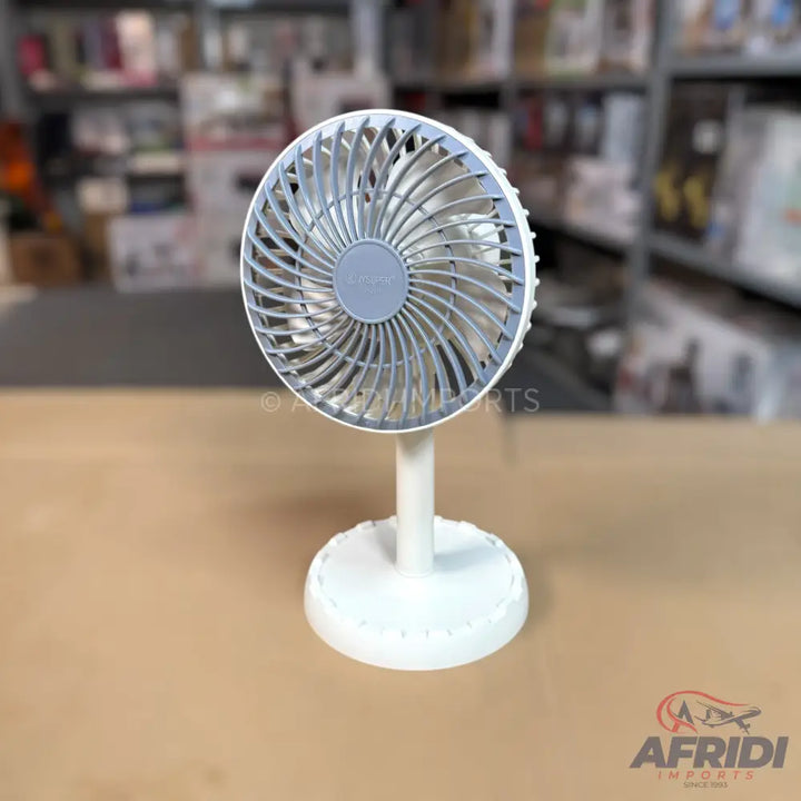 White desk fan with a light gray fan guard.