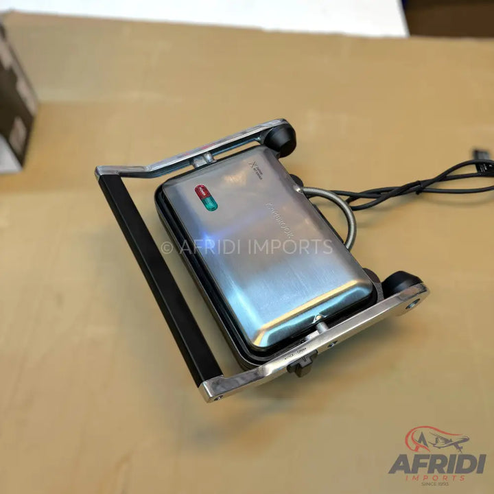 Stainless steel electric sandwich maker with indicator lights.