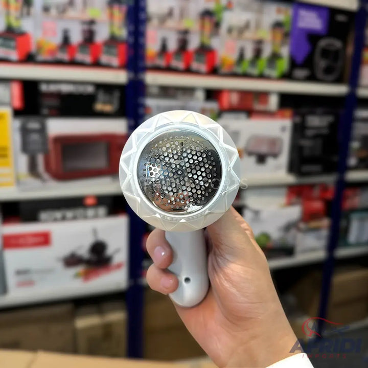 White fabric shaver with a diamond-patterned head and a mesh screen.