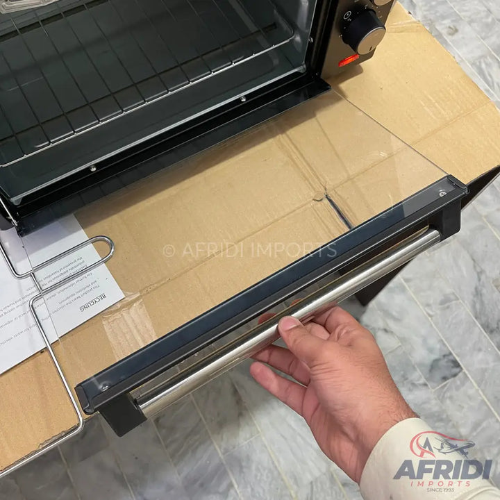 Black electric oven with a stainless steel handle.