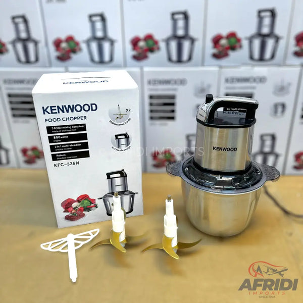 A Kenwood food chopper with a stainless steel bowl and two sets of blades.