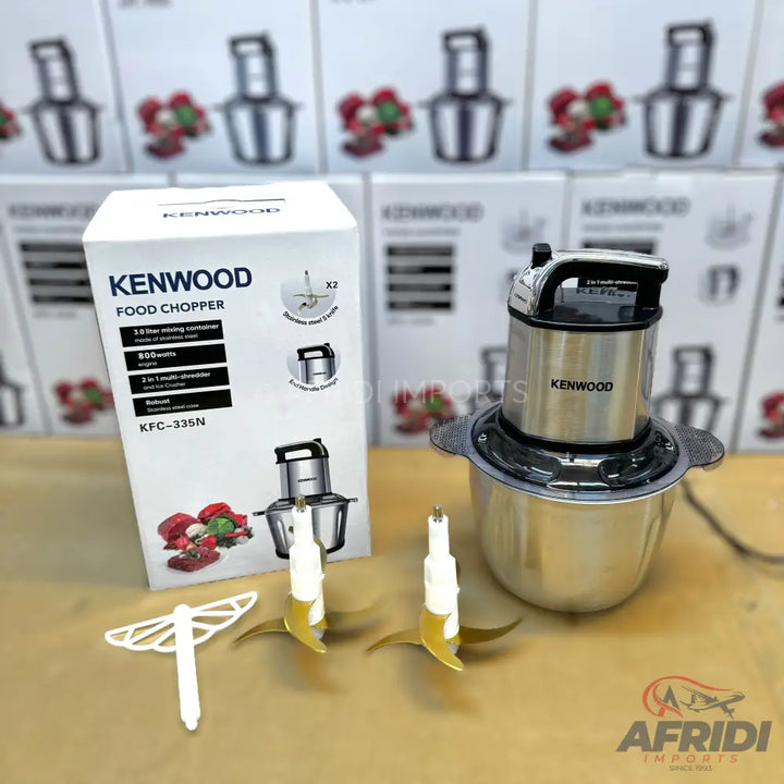 A Kenwood food chopper with a stainless steel bowl and two sets of blades.
