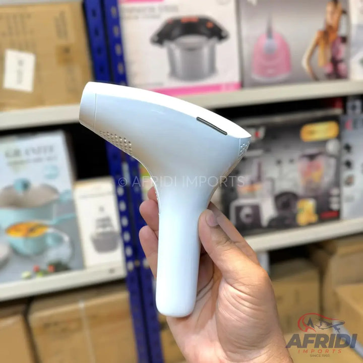 White handheld laser hair removal device.