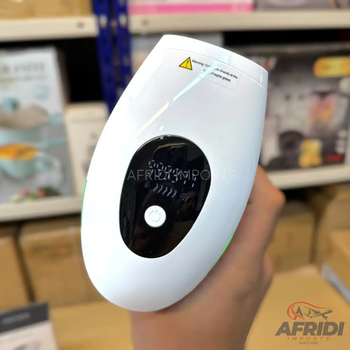 White handheld IPL hair removal device with a digital display and power button.