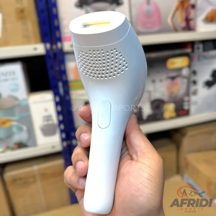 White IPL hair removal device with a rectangular light window and a side power button.