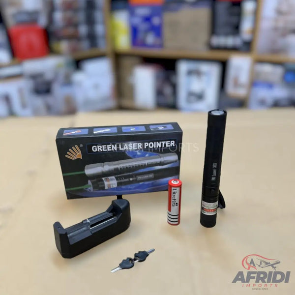 Green laser pointer kit with charger, battery, and safety keys.