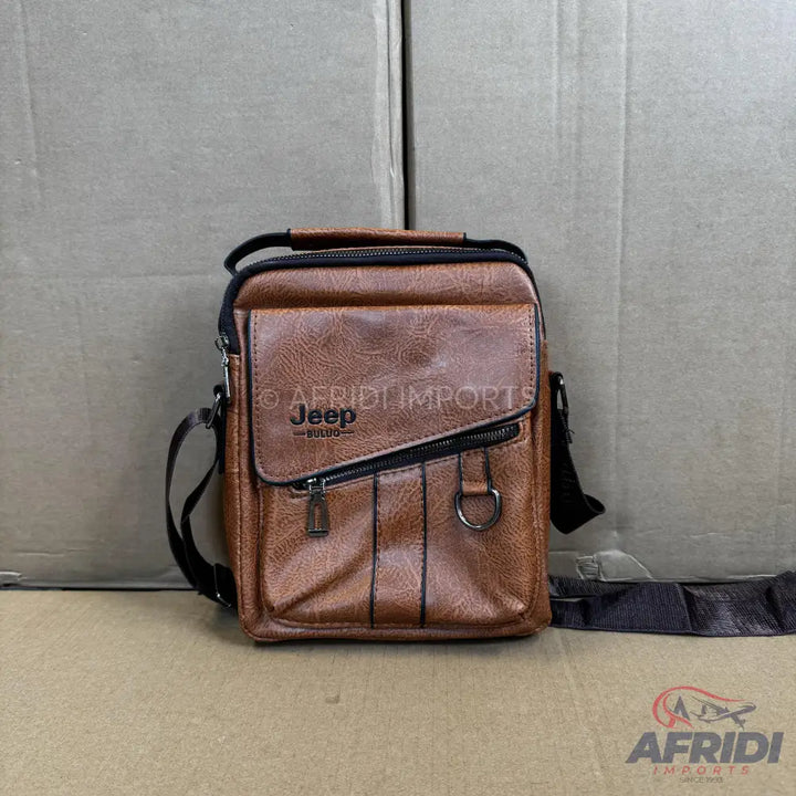 Brown faux leather shoulder bag with multiple compartments and zippers.