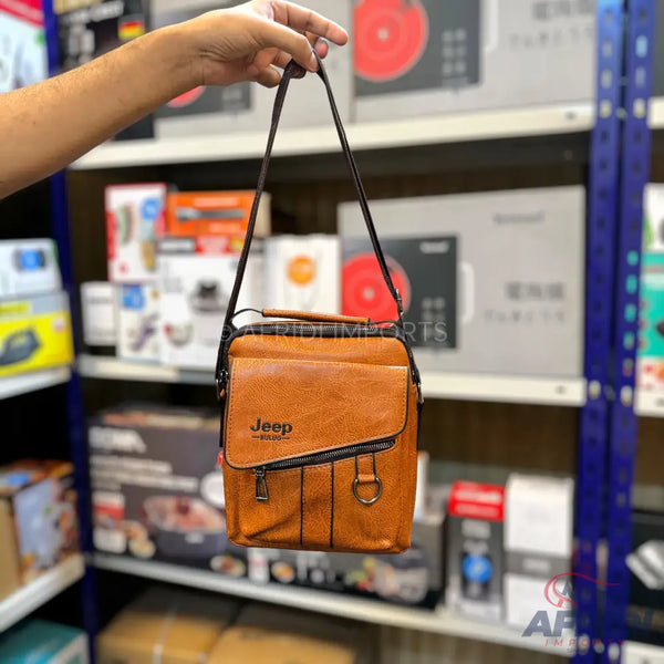 Brown leather messenger bag with a shoulder strap.