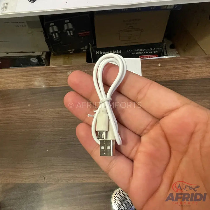 White USB to micro-USB charging cable.
