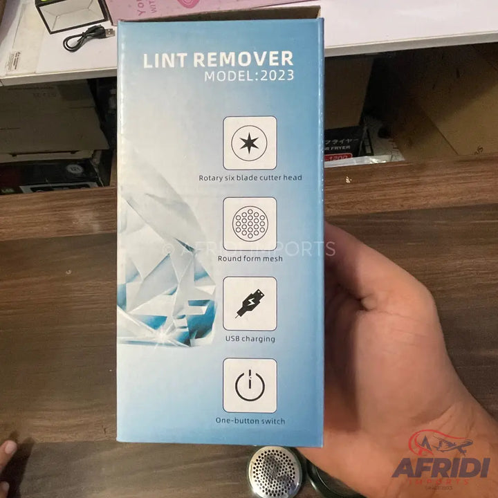 Boxed lint remover featuring a rotary six-blade cutter head, round form mesh, USB charging, and a one-button switch.