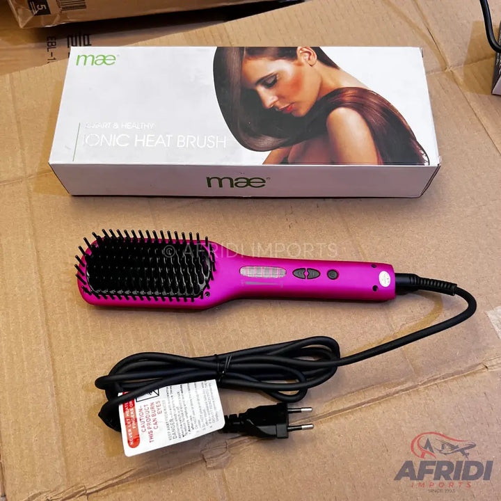Pink electric hair straightening brush with a black cord and two-prong plug.
