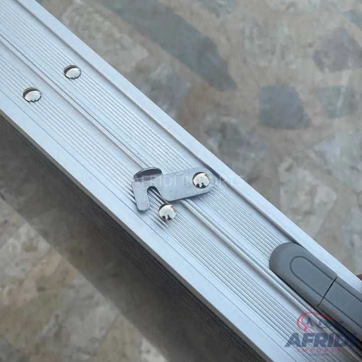 Aluminum sliding window track with a latch and pull handle.
