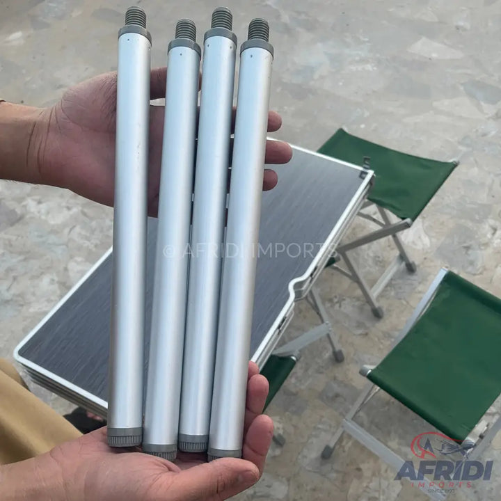 Four silver-colored metal table legs with threaded tops and rubberized feet.