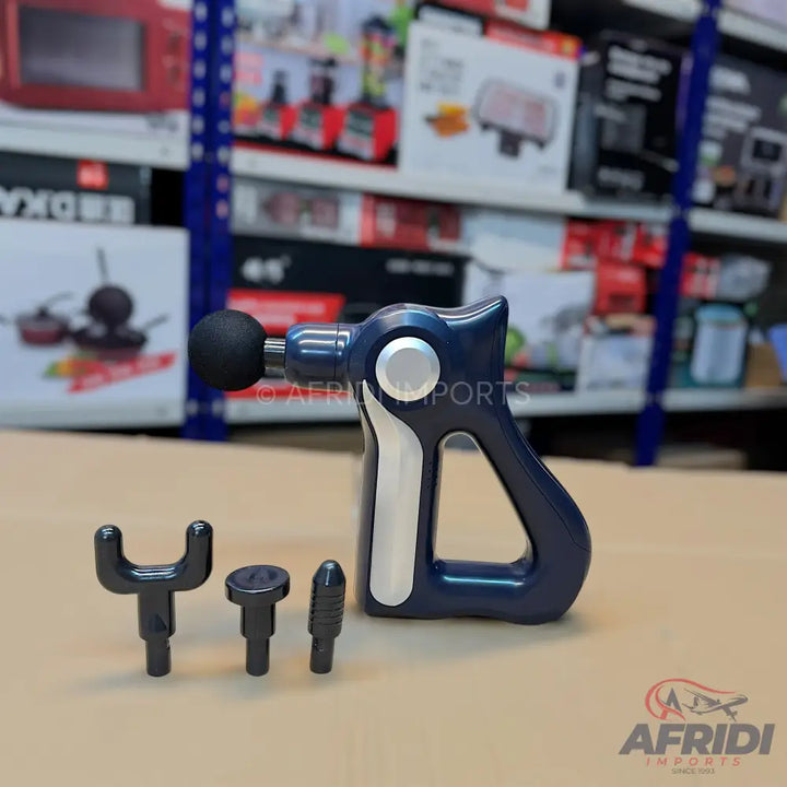 Dark blue handheld percussion massage gun with three interchangeable head attachments.