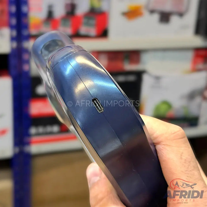 Handheld electric lint remover with a USB-C charging port.