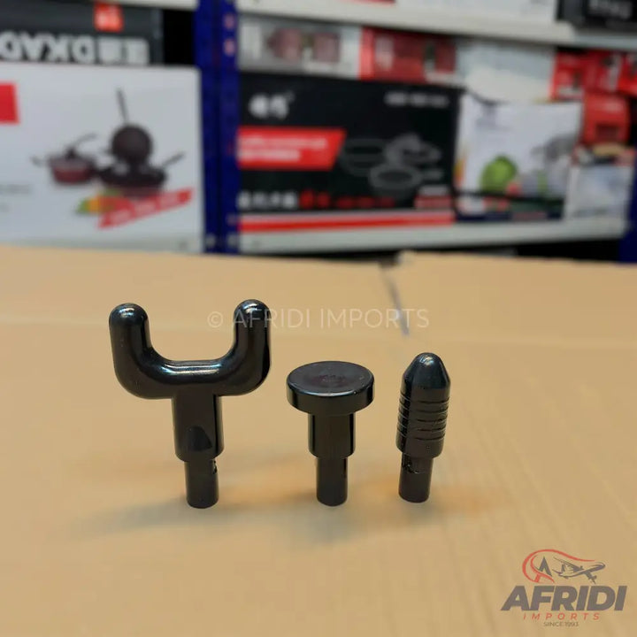 Three black massage gun attachments of varying shapes.