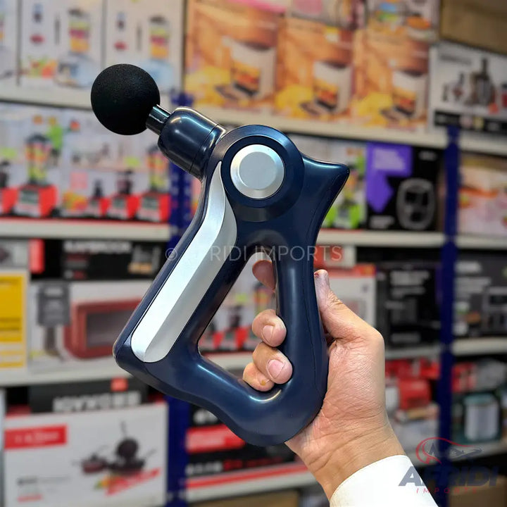 A dark blue handheld massage gun with a spherical black attachment and silver accents.