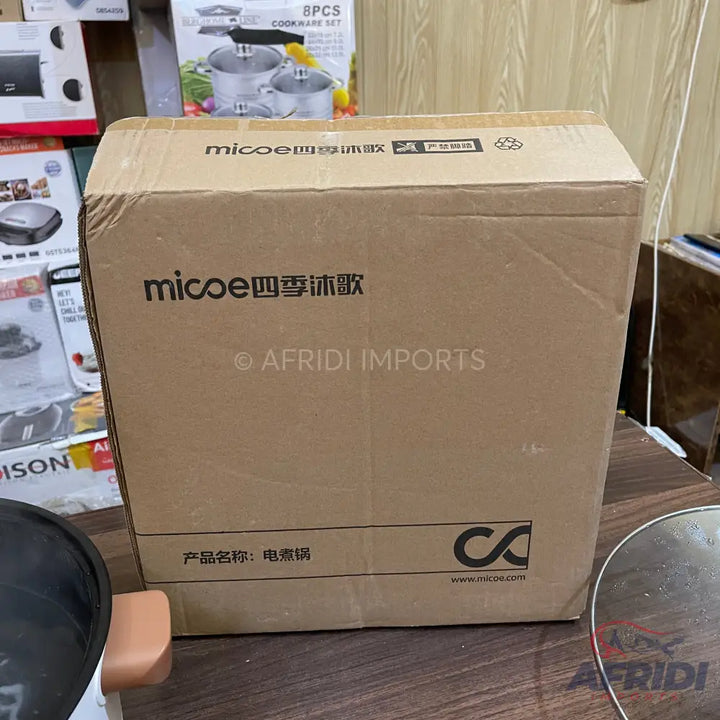 Cardboard box for a Micoe electric cooker.