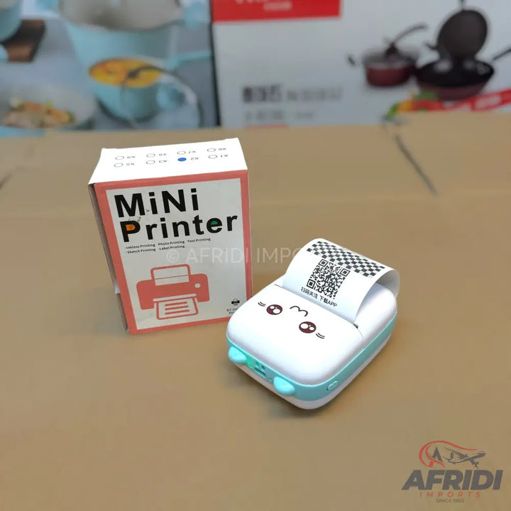 A compact, portable thermal printer with a cute cartoon face design.